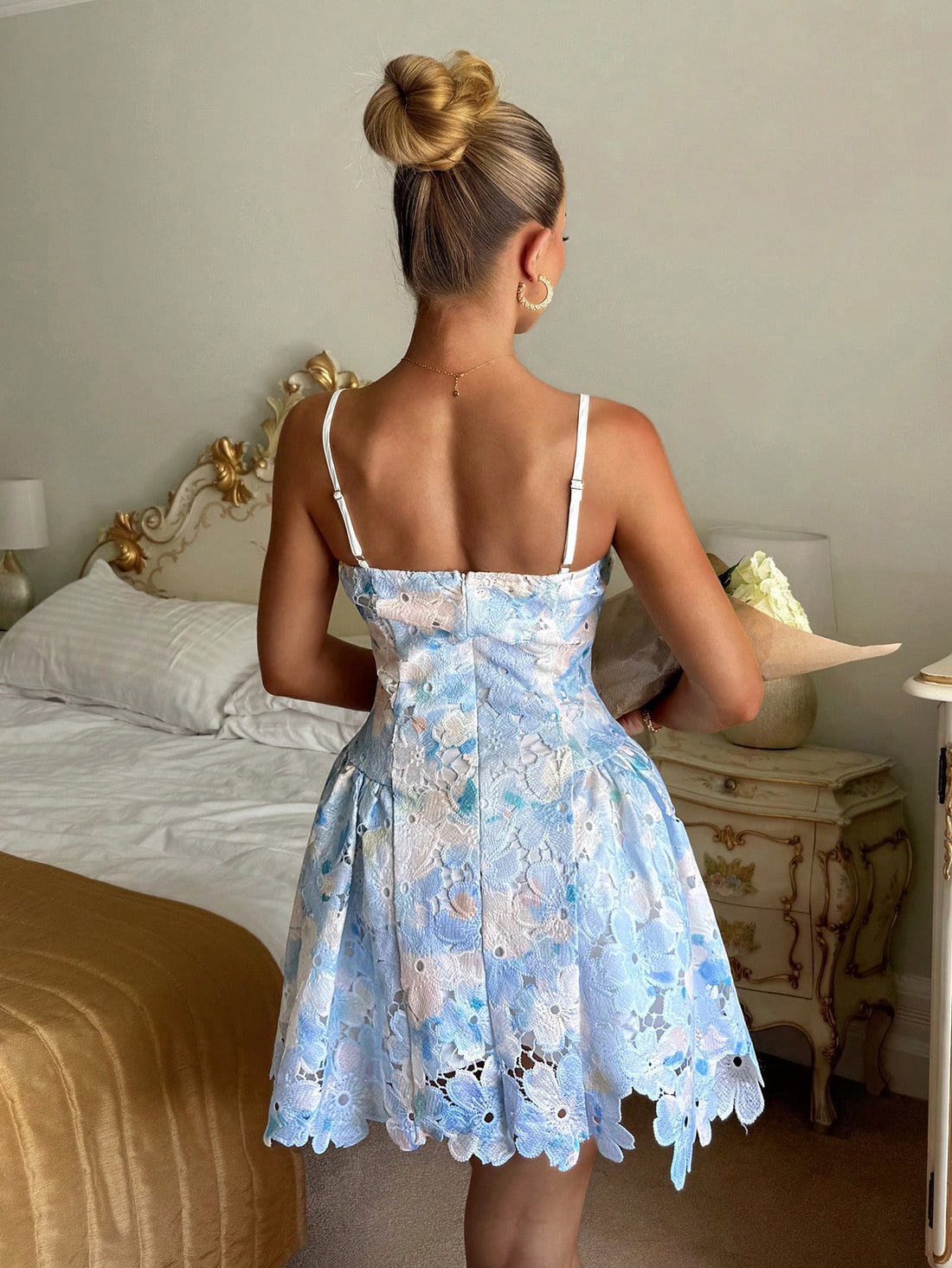 Twirl into summer style with this enchanting floral mini dress! Delicate hollow embroidery adds an elegant touch while the adjustable waist tie lets you customize your silhouette for the perfect fit. The cheerful floral print brings instant joy to any occasion—whether you're sipping tea with friends or celebrating special moments. Light, breezy, and undeniably charming, this dress is your go-to piece for creating picture-perfect memories all season long.