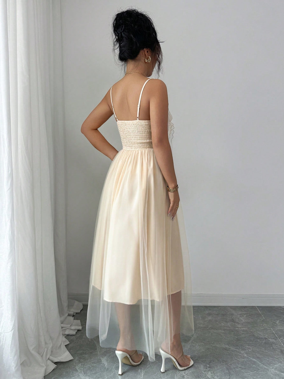 Step into charm and grace with this elegant long dress designed to delight. Featuring delicate butterfly embroidery and slender spaghetti straps, it adds a whimsical touch to your chic occasions. The flowing silhouette moves with you, ensuring you feel as fabulous as you look. Perfect for those moments when you want to flutter through the room effortlessly!