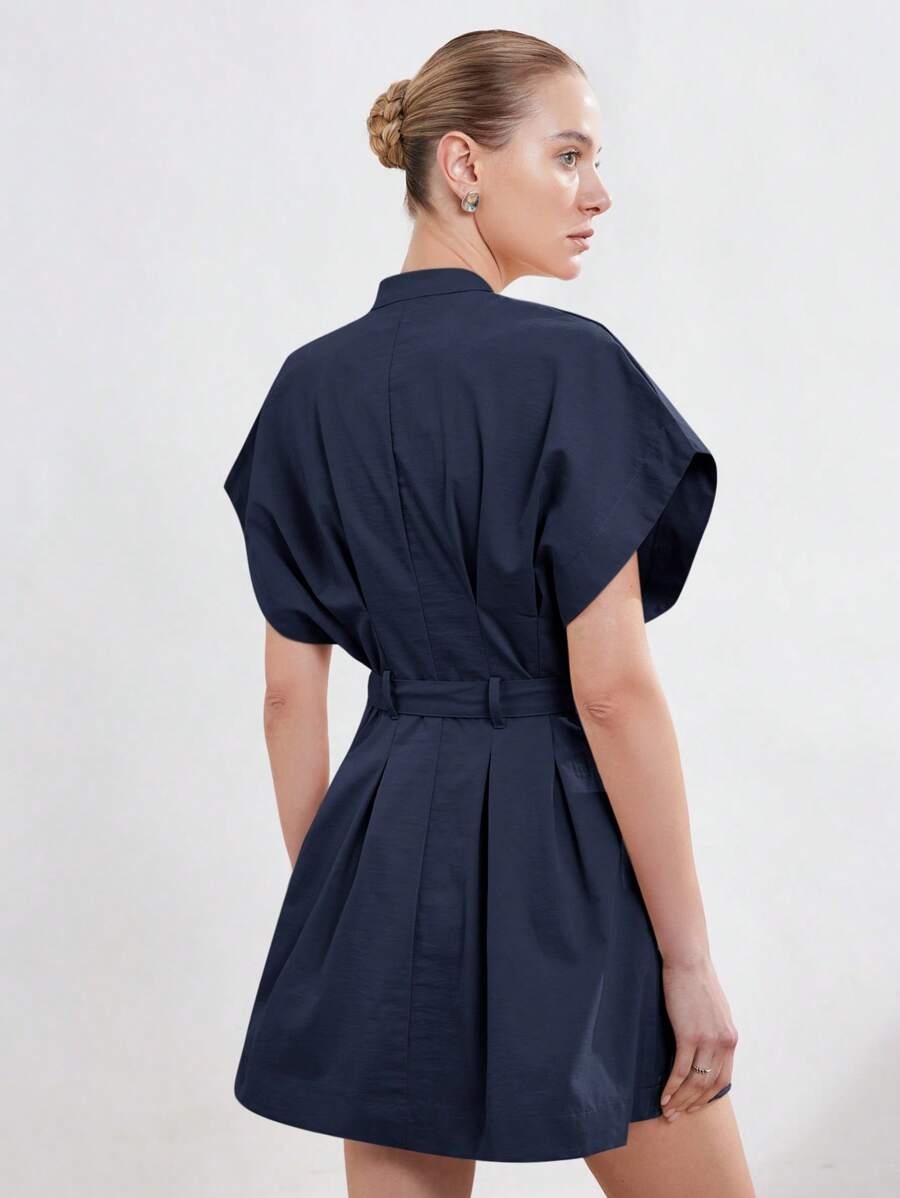 Master the Art of Professionalism in Our Chic Minimalist Fit and Flare Dress!

Redefine your workwear wardrobe with a silhouette that balances sharp tailoring with effortless femininity. This minimalist masterpiece is designed for the modern professional who values a polished, "power-dressing" aesthetic that transitions seamlessly from high-stakes boardrooms to evening city commutes.

Sophisticated Stand Collar: The clean, structured neckline adds an architectural touch of authority and elegance, offering a