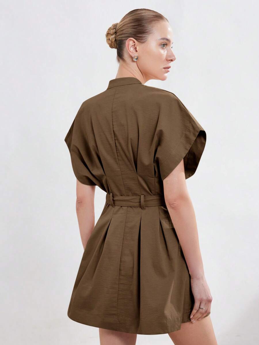 Step out in style with this chic A-line mini dress designed to flatter every curve. Featuring a playful ruched tie waist that adds a touch of elegance, cap sleeves for a breezy feel, and a stand collar that brings a modern twist. Perfect for turning heads at any occasion while keeping comfort front and center.