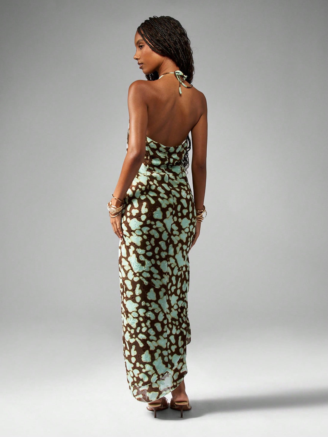 Turn heads this summer with our Chic Abstract Print Halter Neck Maxi Dress, perfect for vacations and beach weddings. Its vibrant abstract design and breezy halter neck create a playful vibe that dances with the ocean breeze. Lightweight and flowy, this dress keeps you cool while making every step feel like a celebration. Embrace effortless style that’s ready for sun-soaked memories and seaside romance.