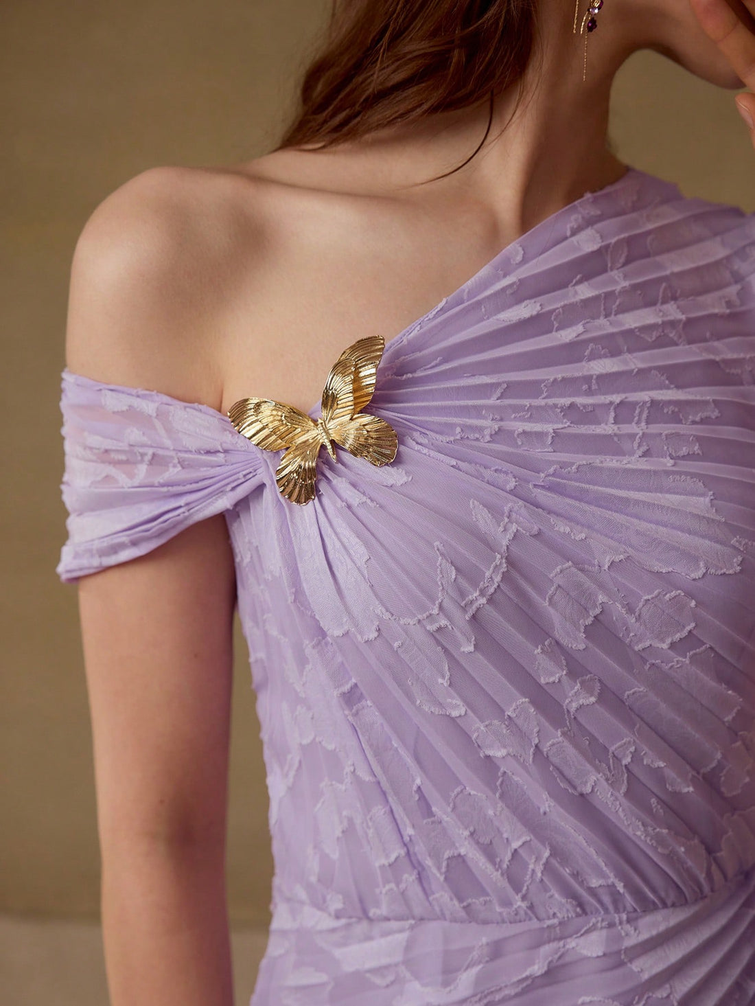 Step into the spotlight with this Elegant Pleated Dress, featuring a charming metal butterfly accent that adds a whimsical touch to your look. Its flowing pleats create graceful movement, perfect for twirling at any stylish occasion. Light, lively, and effortlessly chic, this dress is your new go-to for turning heads with a playful flair.