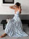 Blue and white floral cutout waist tiered maxi dress, seated front view