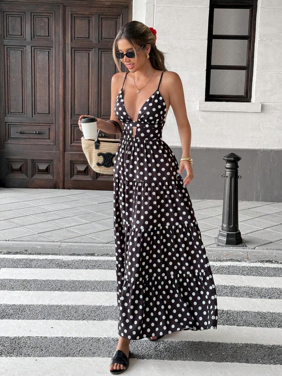 Effortless vacation style meets everyday comfort in this loose-fitting polka dot dress. Delicate spaghetti straps and a relaxed silhouette make it perfect for warm-weather getaways, casual outings, or lazy days at home. The playful patchwork hem adds a unique touch that sets it apart. 