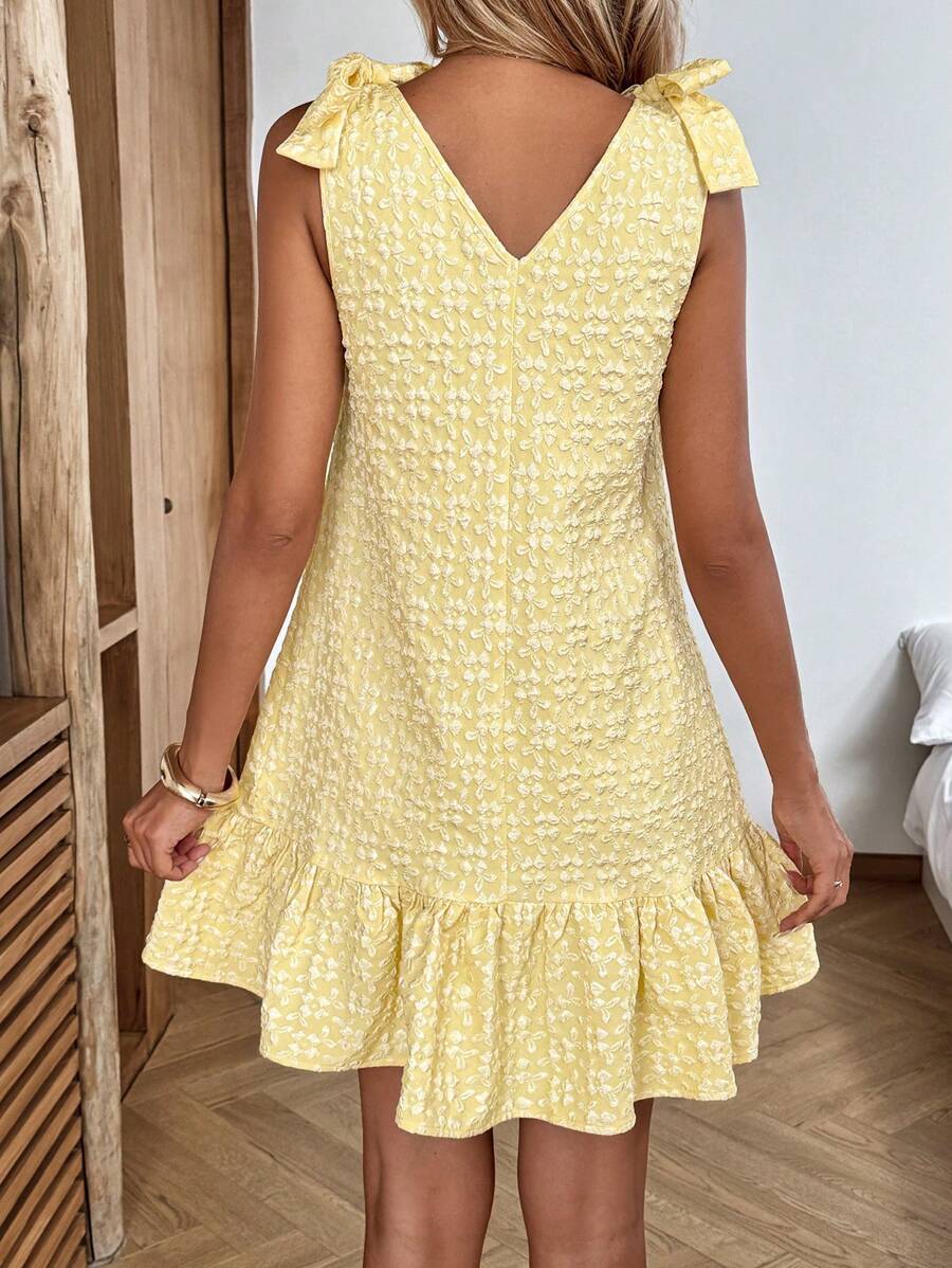Sunshine never looked so good! This charming pale yellow mini dress brings effortless elegance to your warm-weather wardrobe. The delicate bow accent adds a flirty touch that works beautifully for casual outings, beach getaways, or laid-back vacation vibes. Lightweight and breezy, it's the perfect go-to piece when you want to feel put-together without trying too hard. Pair it with sandals for a relaxed day look or dress it up with accessories for evening fun. Your summer style just got a major upgrade!
