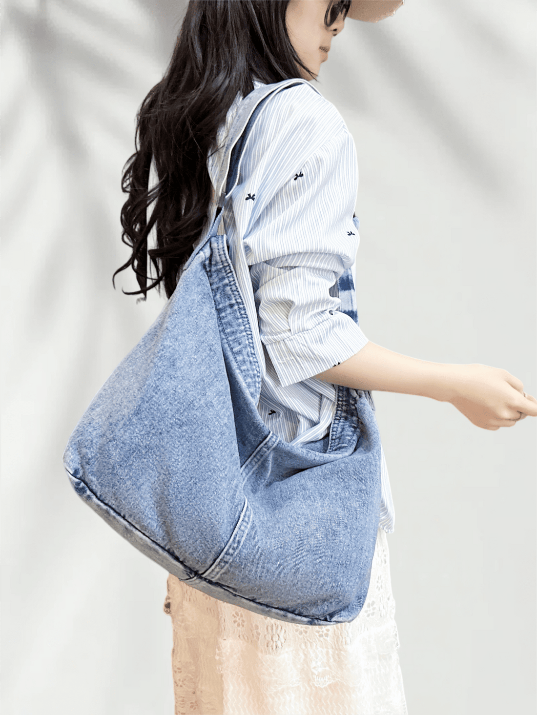 Elevate your everyday carry with this versatile blue shoulder bag, designed for the modern woman who values both form and function. Featuring a spacious interior that accommodates laptops, tablets, and daily essentials, this hobo-style crossbody seamlessly transitions from office to weekend outings. The minimalist aesthetic pairs effortlessly with any wardrobe, while the adjustable shoulder strap ensures comfortable, hands-free wear. Crafted with attention to detail, this tote combines practical capacity wi