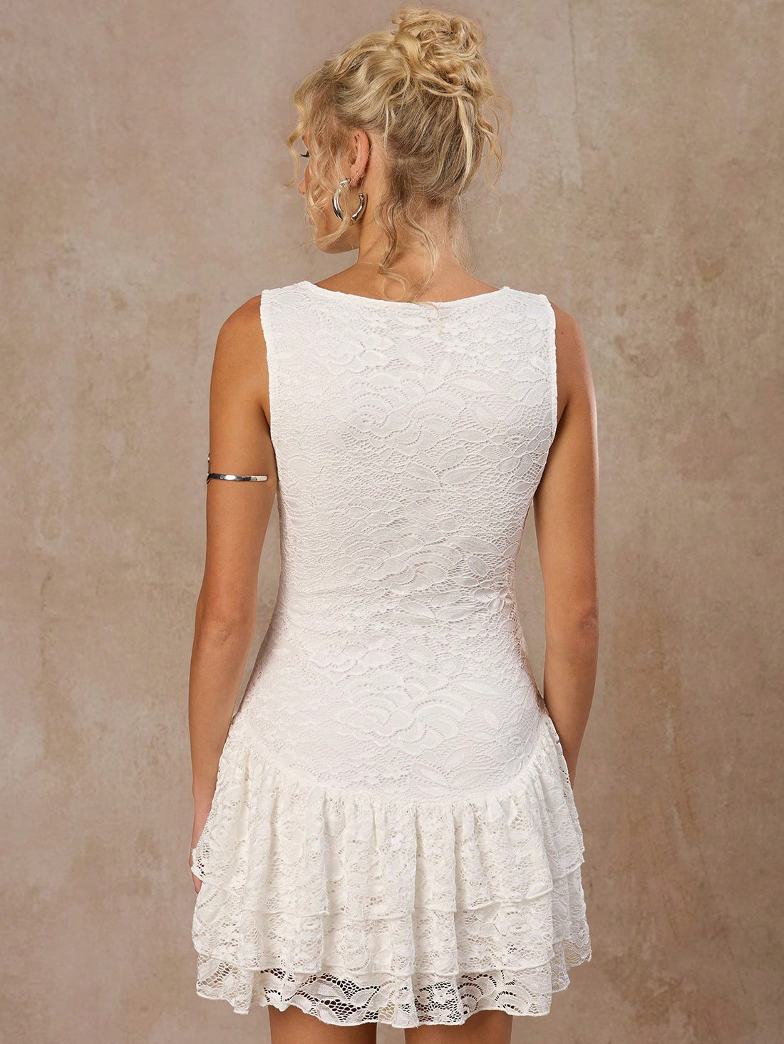 Step into summer with this Elegant Sleeveless Lace Fitted Dress, designed to highlight your silhouette while keeping things light and breezy. The delicate lace adds a touch of romance, perfect for sunny days and warm evenings. Whether you're out for brunch or dancing under the stars, this dress brings effortless charm and playful sophistication to your wardrobe.