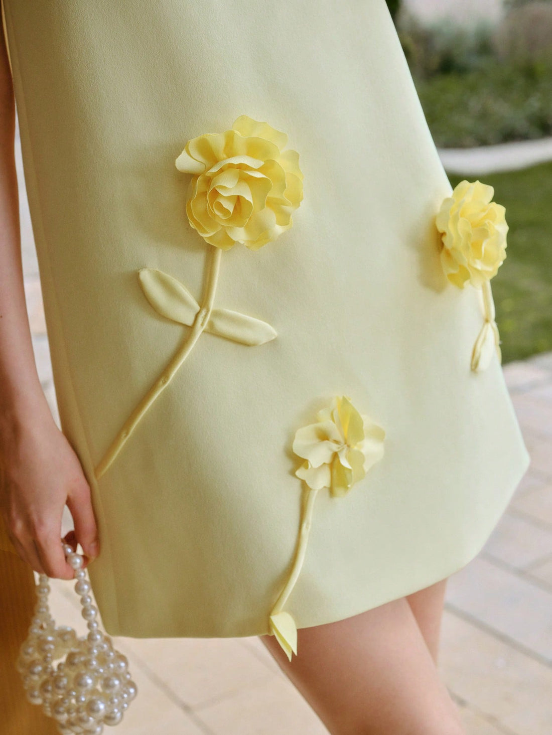 Step into summer with this Floral Detail Tank Dress, designed to keep you cool and stylish. Its delicate floral accents add a touch of whimsy, while the breezy tank silhouette ensures comfort all day long. Perfect for sunny days and spontaneous adventures, this dress makes effortless chic look easy and fun.