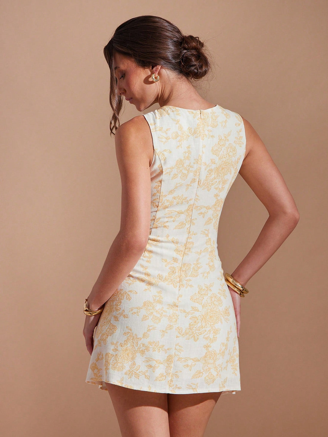 Step into summer fun with this playful sleeveless dress featuring a vibrant all-over print and charming button front. Lightweight and breezy, it keeps you cool while adding a splash of effortless style wherever you go. Perfect for sunny days and spontaneous adventures!