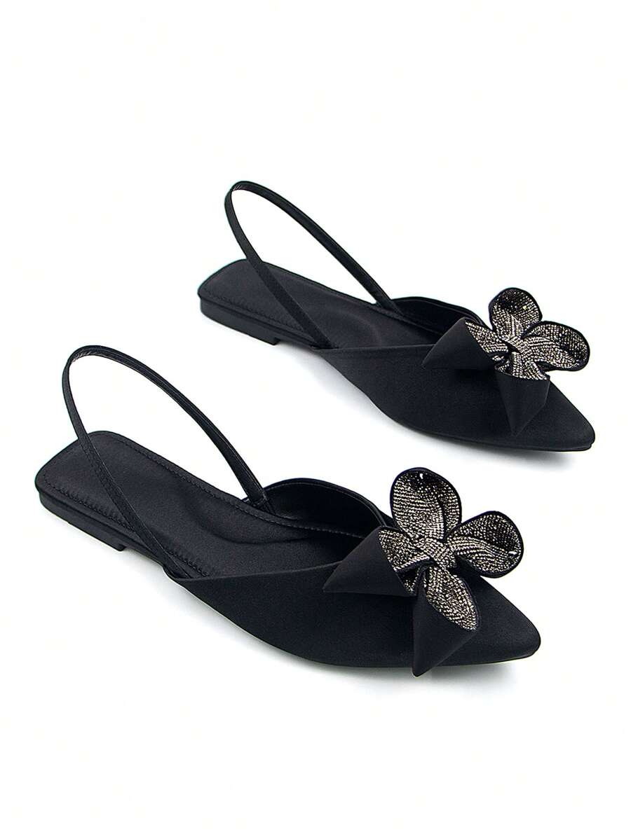 Step into charm with these elegant chocolate brown slip-on flat sandals, featuring a playful flower bow adorned with sparkling cubic zirconia. Designed for comfort and style, they effortlessly brighten any outfit while keeping your feet happy all day long. Perfect for adding a touch of whimsy to your look!