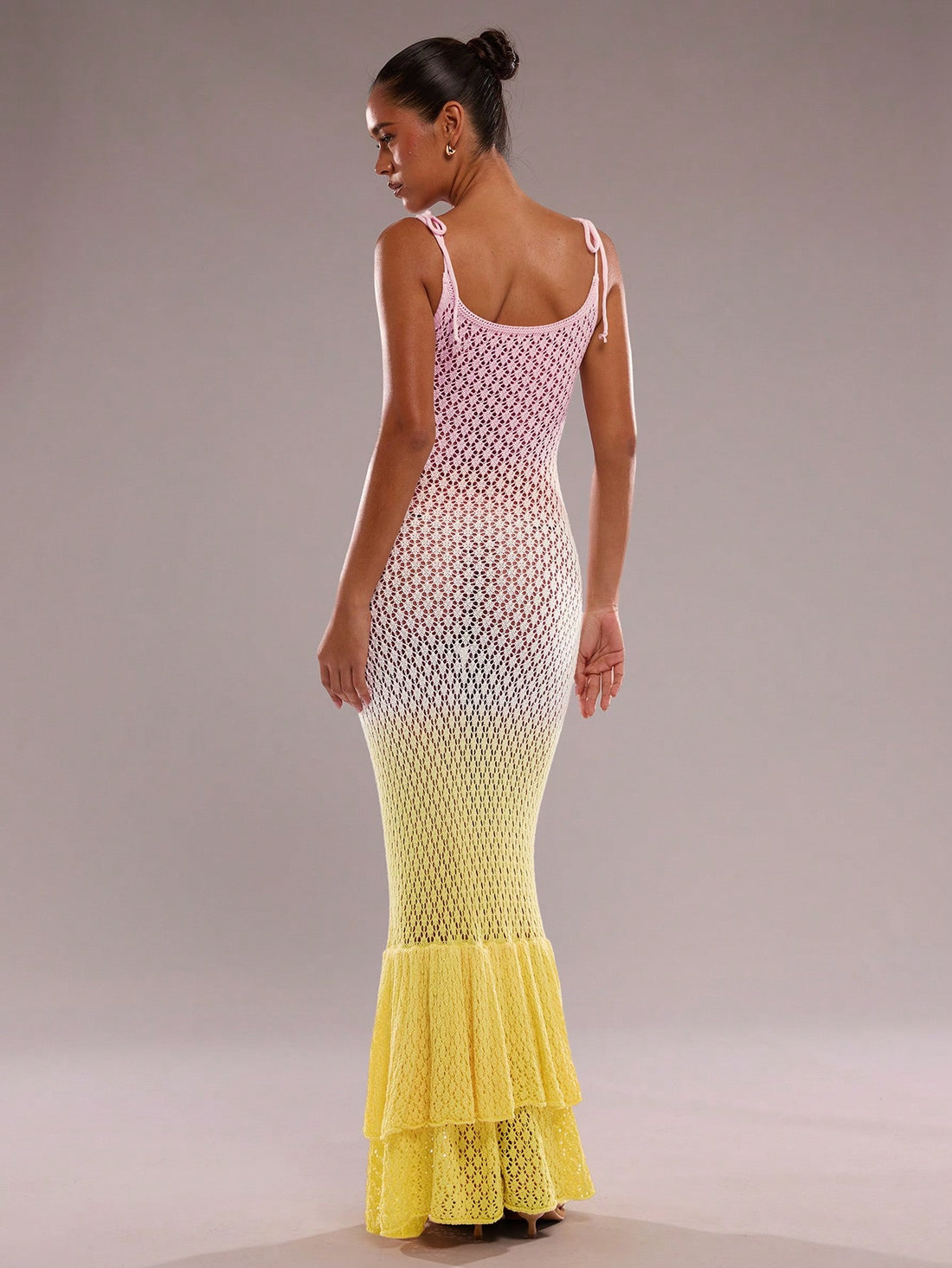 Step into summer with this playful fishtail knit dress, perfect for seaside adventures. Featuring charming ruffles and a stylish gradient hollow-out design, it combines comfort and flair effortlessly. Its breezy knit fabric keeps you cool while the fishtail silhouette adds a fun, flirty touch to your vacation wardrobe. Ideal for beach strolls or sunset dinners, this dress brings a splash of elegance to your sunny getaways.