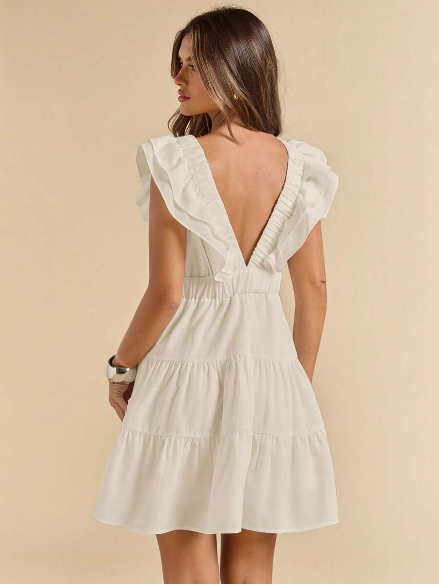 Back view white mini dress with deep V open back ruffle strap edges and gathered waist