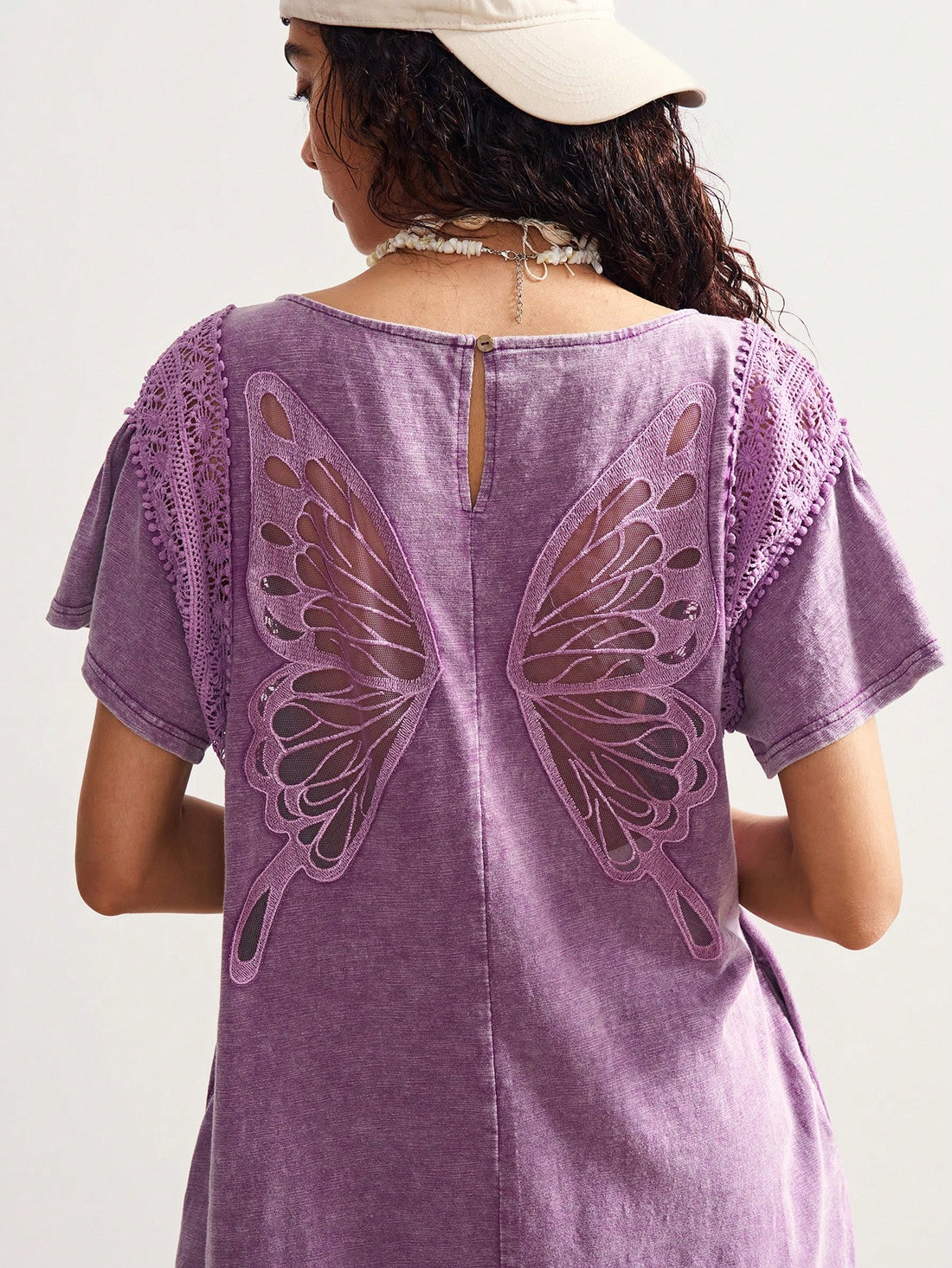 Step into effortless charm with the Bohemian Butterfly Back Mini Dress. This playful, solid-color knit dress features short sleeves and a flirty mini length, perfect for holiday adventures or casual days out. The unique butterfly back detail adds a whimsical touch, making it a fun and comfortable choice for warm-weather style.