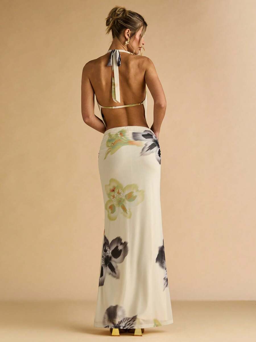 Front view of ivory floral halter top with draped cowl neckline and maxi skirt