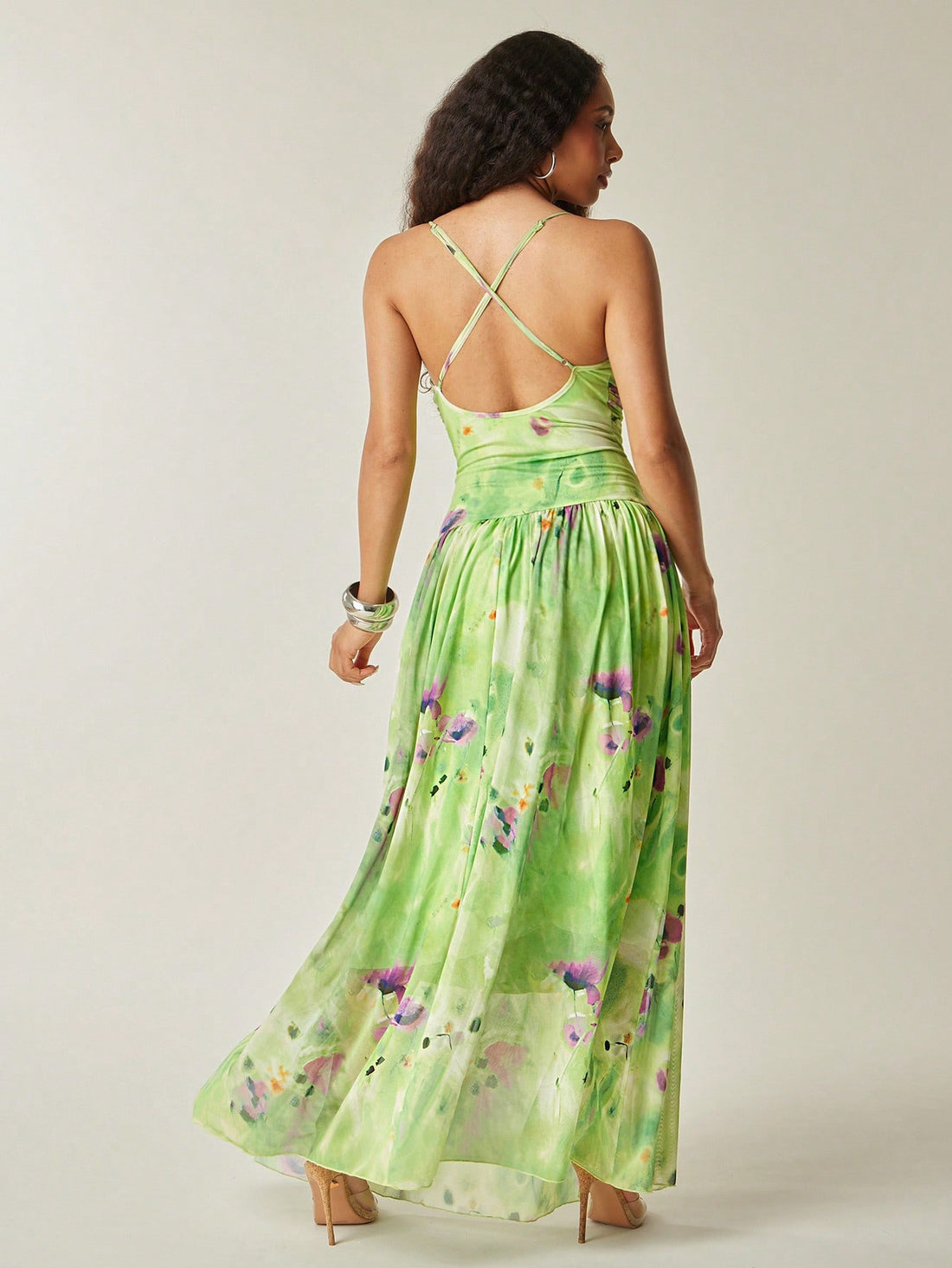 Step into summer celebrations with the Floral Print Mesh Maxi Dress. Its playful ruched drop waist flatters your figure, while the open back adds a flirty touch. Lightweight mesh fabric keeps you cool and comfortable, making it the perfect pick for wedding guests who want to dance the night away in style.