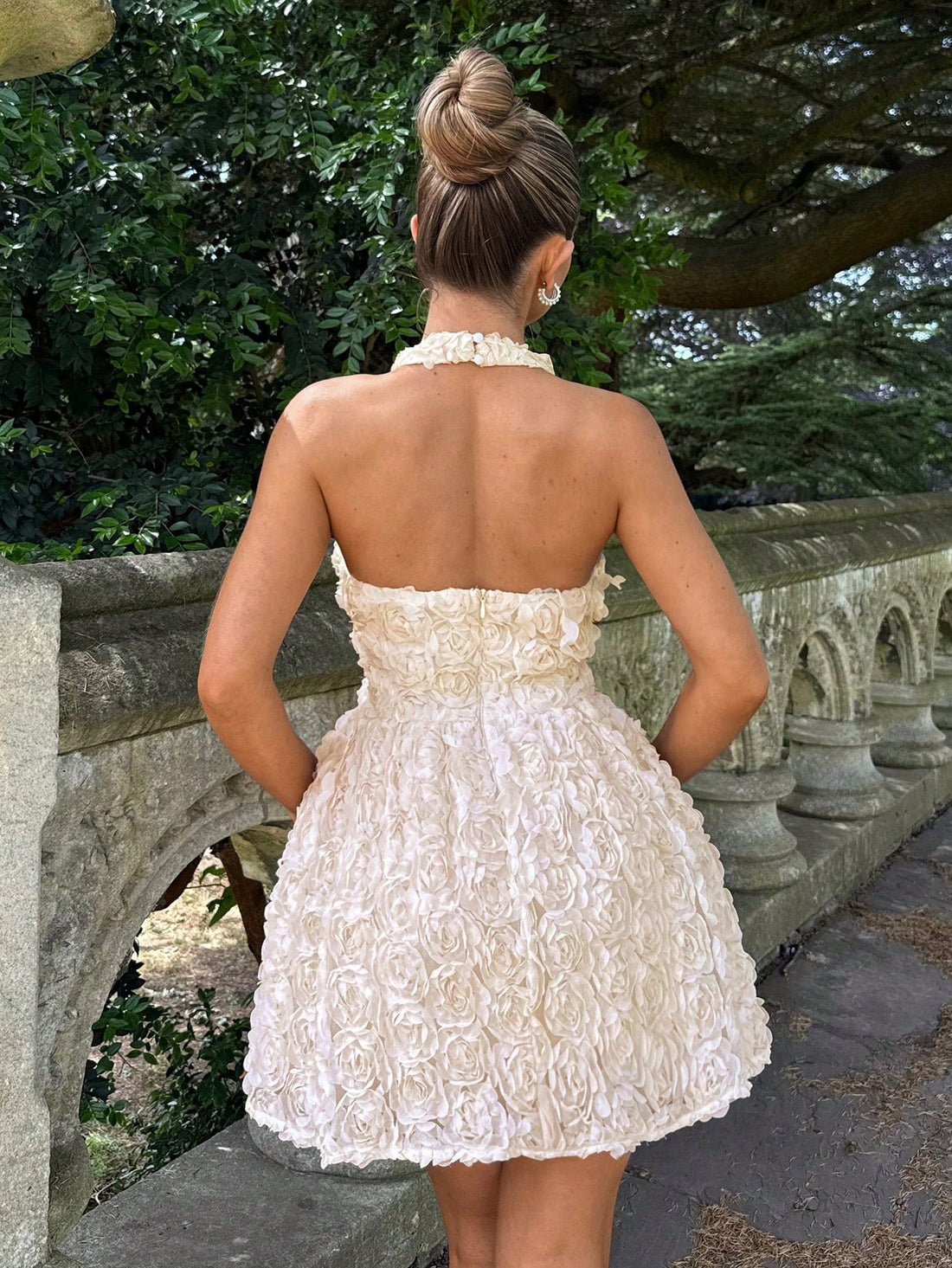 Step into the spotlight in this show-stopping champagne halter neck dress! Featuring stunning 3D floral embellishments that add dimension and drama, this short dress is your go-to for weddings, cocktail parties, and unforgettable nights out. The flattering halter neckline frames your shoulders beautifully while the delicate florals catch every light. Whether you're dancing the night away or making a grand entrance, this dress delivers elegance with a fun, flirty twist. Slip it on and watch heads turn!