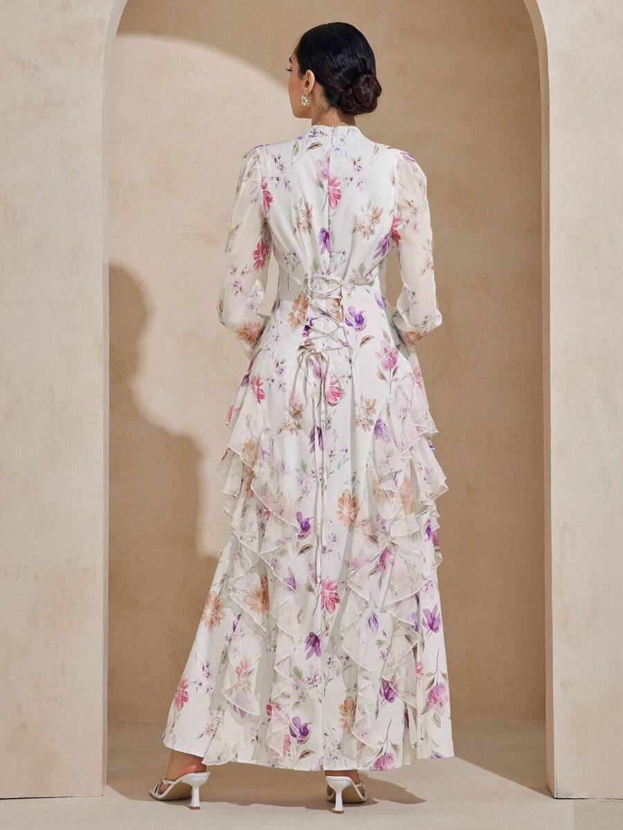 Twirl into elegance with this charming modest dress that celebrates timeless style. Featuring a delicate floral print that dances across the fabric, this extra-long silhouette offers graceful coverage while the playful ruffle hem adds a touch of whimsy. The adjustable tie waist lets you cinch and customize your fit, creating a flattering shape that feels just right. Perfect for garden parties, casual outings, or whenever you want to feel put-together and fabulous. Comfort meets sophistication in one delight