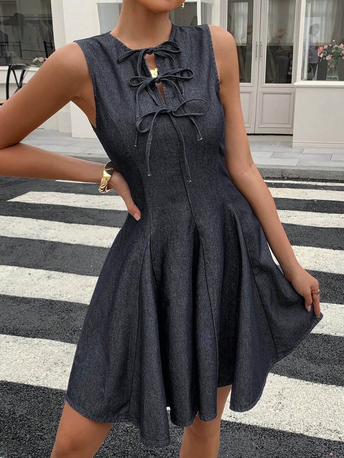 Step into summer with this playful denim dress designed just for you! Featuring a breezy sleeveless cut and charming tie-up details, it offers a relaxed fit that keeps you cool and comfy all day long. Perfect for sunny days and casual outings, this dress adds a fun, stylish twist to your warm-weather wardrobe.