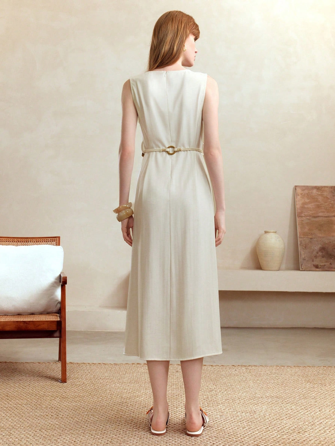 Step into autumn with a playful twist in this Elegant Apricot Linen Midi Dress. Its breezy sleeveless design and round neck keep things light, while the hemp rope belt adds a charming, rustic touch. Perfect for crisp days, this dress blends comfort and style effortlessly, making every moment feel like a cozy, sunlit stroll.