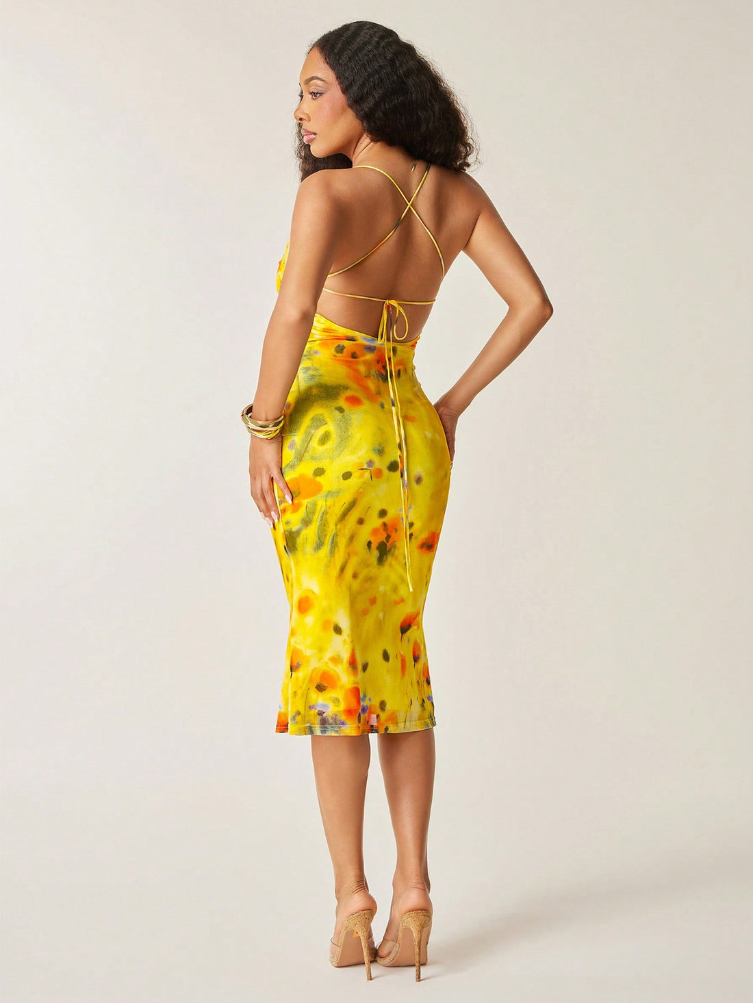 Step into summer with this Abstract Floral Print Mesh Midi Dress, designed to turn heads with its playful elegance. The soft cowl neck adds a touch of sophistication, while the lace-up open back brings a flirty, breezy vibe perfect for warm days and nights. Lightweight mesh fabric ensures comfort and breathability, making it your go-to dress for garden parties, brunches, or sunset strolls. Embrace effortless style and let your summer adventures bloom in this charming midi dress.