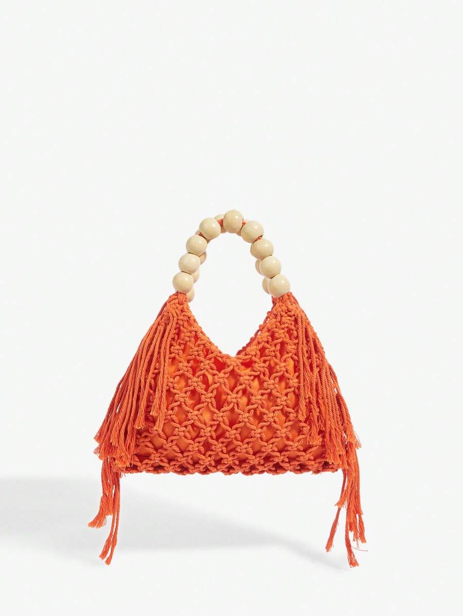 Orange crochet beach bag front view with net knit body side fringe and round bead handle