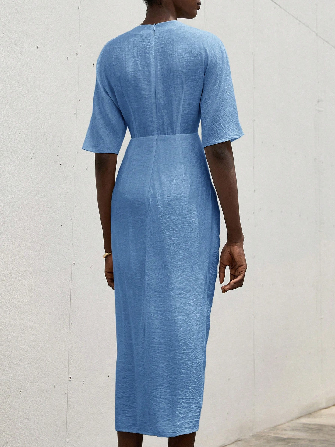 Turn heads effortlessly in this chic V-neck ruched bodycon midi dress. Designed with long sleeves and a flattering ruched detail, it hugs your curves while adding a playful touch to your look. Perfect for stylish women who want to blend elegance with a hint of fun, this dress is your go-to for any occasion that calls for confidence and charm.