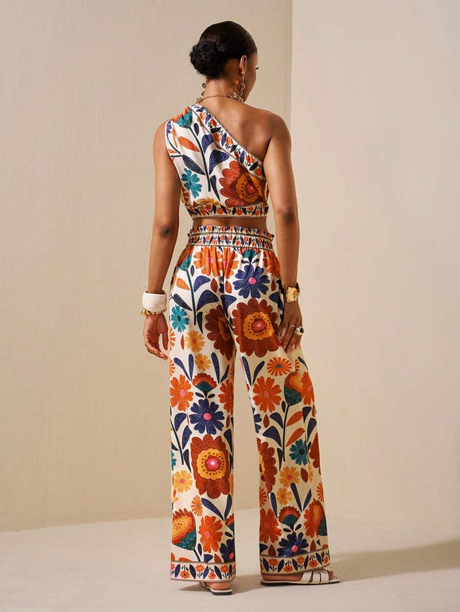 Effortlessly chic meets comfort in this stunning black two-piece set! The off-shoulder top brings a flirty, modern vibe perfect for showing off your style, while the loose-fitting trousers keep you cool and confident all day long. Whether you're heading to brunch with friends, a casual date night, or dressing up for something special, this versatile duo has you covered. The timeless black palette pairs with everything in your closet, making it the ultimate wardrobe MVP. Dress it down with sneakers or elevat