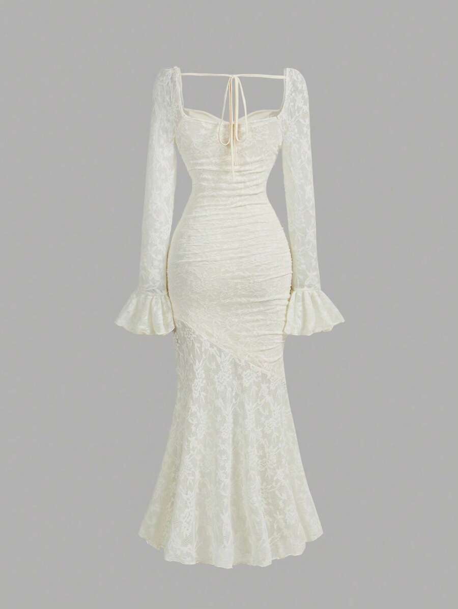 Elevate your special occasion wardrobe with this stunning purple floral mermaid dress. The sophisticated silhouette features a fitted bodice that gracefully transitions into a dramatic fishtail hem, creating an elegant and flattering line. Delicate flare sleeves add a romantic touch while framing the shoulders beautifully. The intricate floral pattern in complementary hues brings depth and visual interest to the rich purple base. Crafted for weddings, galas, and formal events, this dress combines timeless d