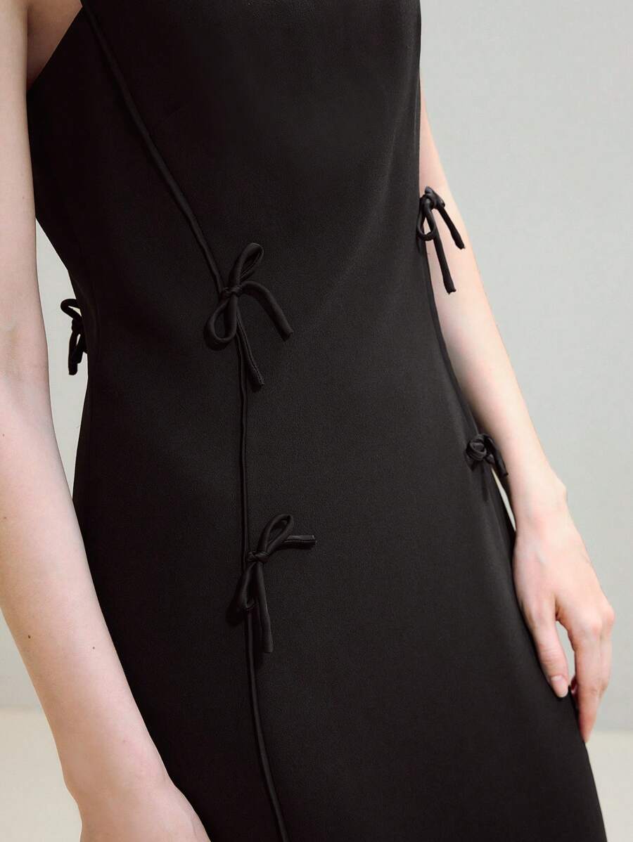 Step out in style with this Elegant Bow Decor Split Hem Dress, designed to turn heads at every occasion. The playful bow detail adds a touch of charm, while the split hem creates a flirty, flowing silhouette. Perfect for parties or special events, this dress blends sophistication with a fun twist, making you the life of any gathering.