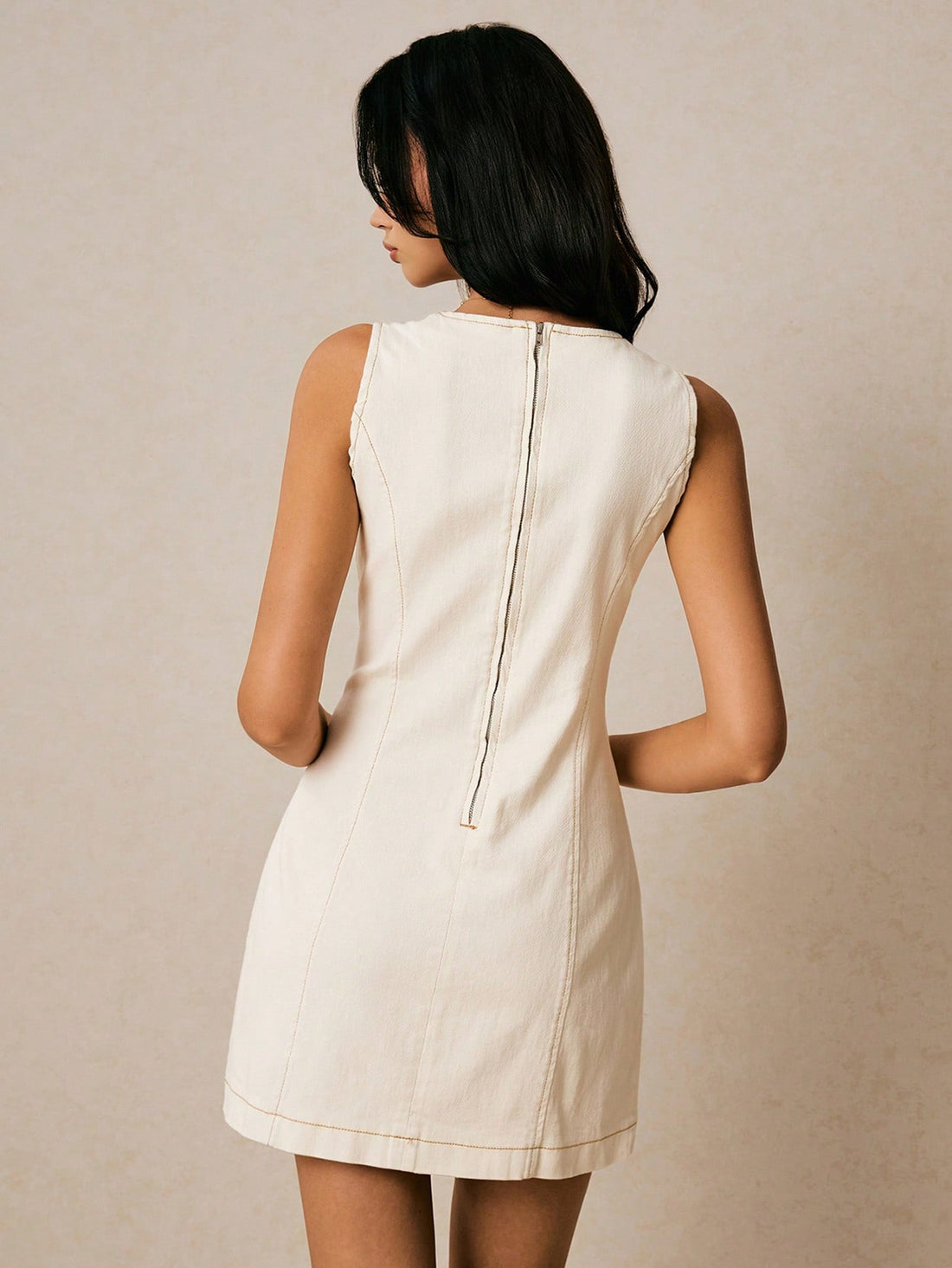 Turn heads this summer with our Fitted Cream Denim Mini Dress! This sleeveless A-line jean tank dress combines comfort and style, perfect for sunny days and casual outings. Its flattering fit and creamy hue make it easy to pair with your favorite accessories for a playful, chic look that’s ready for any adventure.