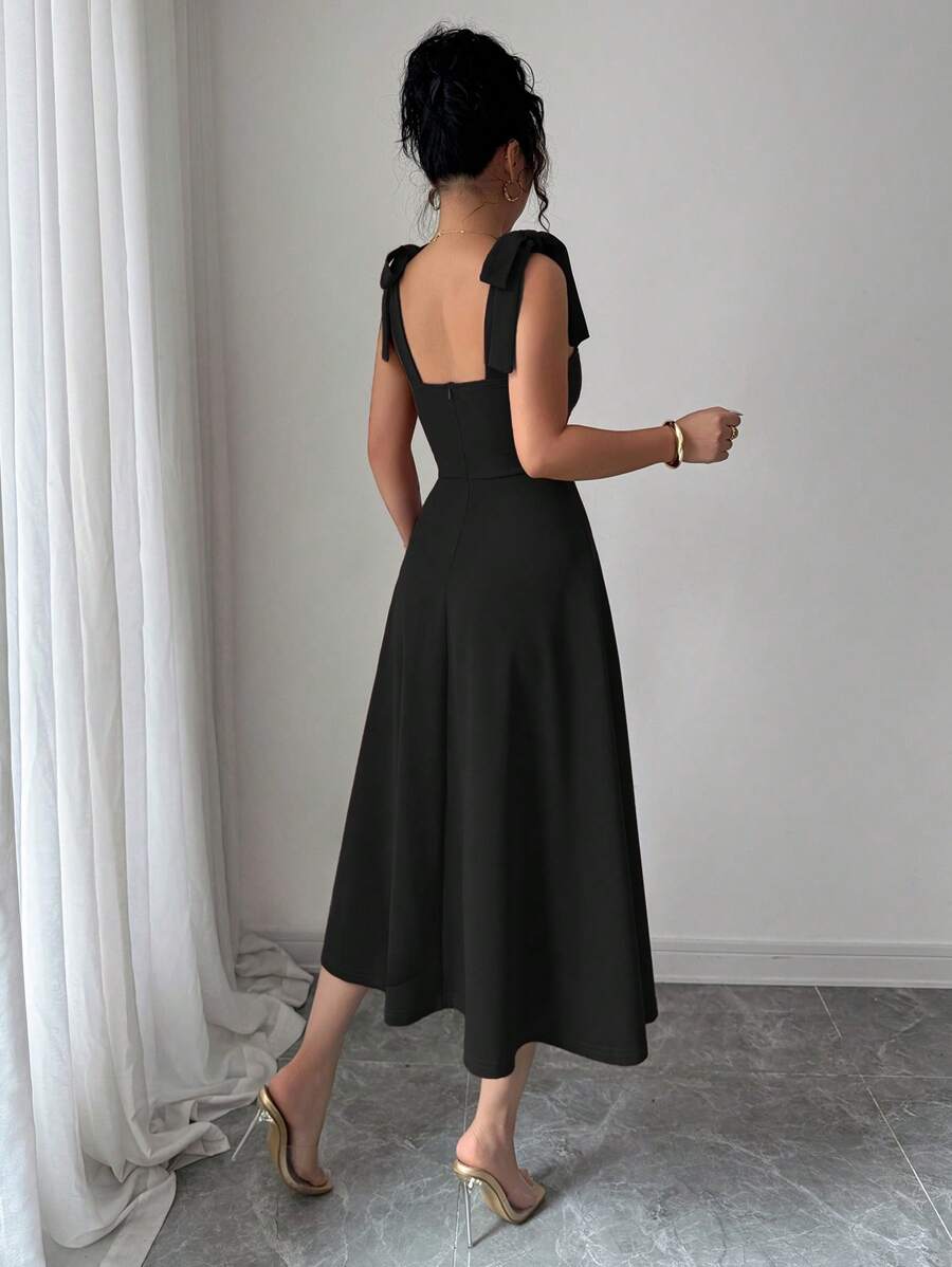 Turn heads effortlessly in this Elegant A-Line Dress featuring a charming sleeveless design with a playful tie-up bow detail. Its flattering silhouette accentuates your shape while adding a touch of romantic flair. Perfect for twirling through sunny days or dancing the night away with a wink of feminine grace.