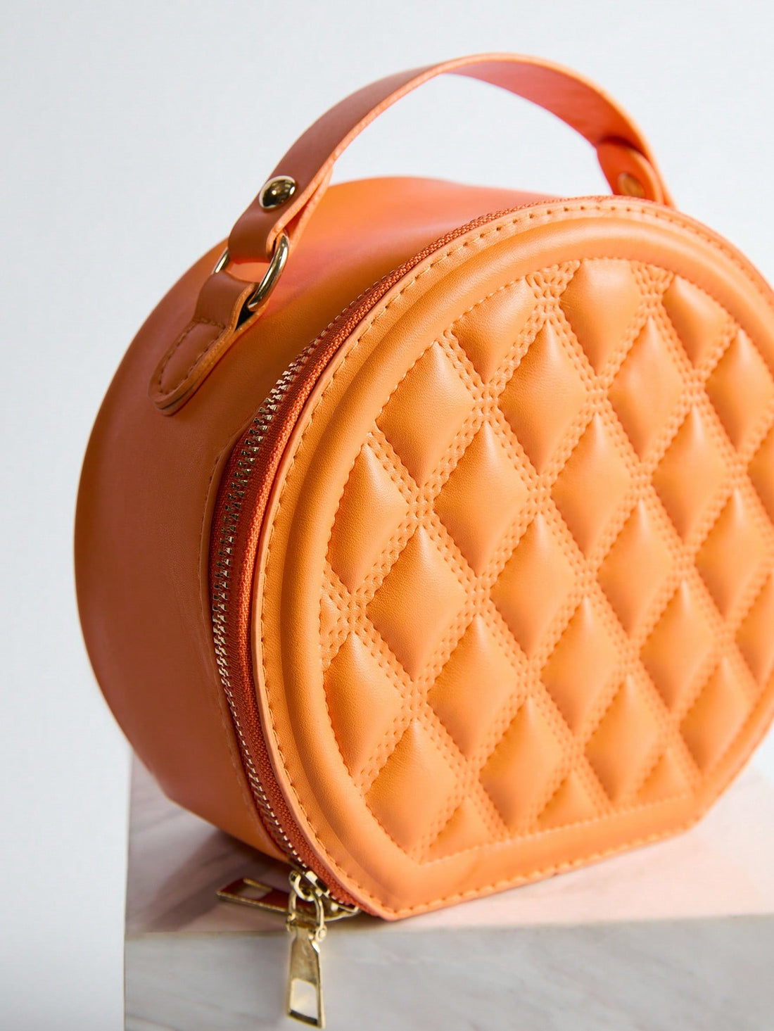 Add a dash of charm to your look with this Chic Mini Quilted Crossbody Bag. Its playful round shape and quilted texture blend style and fun, making it perfect for carrying your essentials hands-free. Whether out for errands or a night on the town, this compact handbag keeps you looking effortlessly cool and ready to go.