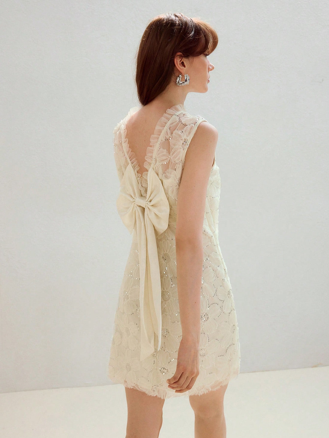 Step into the spotlight with this Elegant Backless Bow Tie Dress, featuring a delicate floral mesh design that adds a touch of whimsy to your look. The playful bow tie at the back creates a flirty silhouette, perfect for turning heads at any stylish occasion. Light, airy, and effortlessly chic, this dress invites you to dance the night away with confidence and charm.