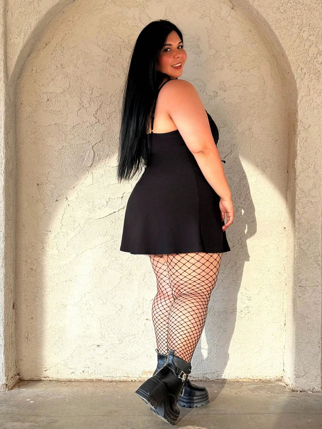 Turn heads at your next celebration in this chic black mini dress designed for curves and confidence. The signature bow detail adds a flirty touch that works beautifully for spring parties, graduations, and any special occasion calling for effortless elegance. Crafted in plus sizes, this dress celebrates your style without compromise—flattering, fun, and ready for the spotlight.