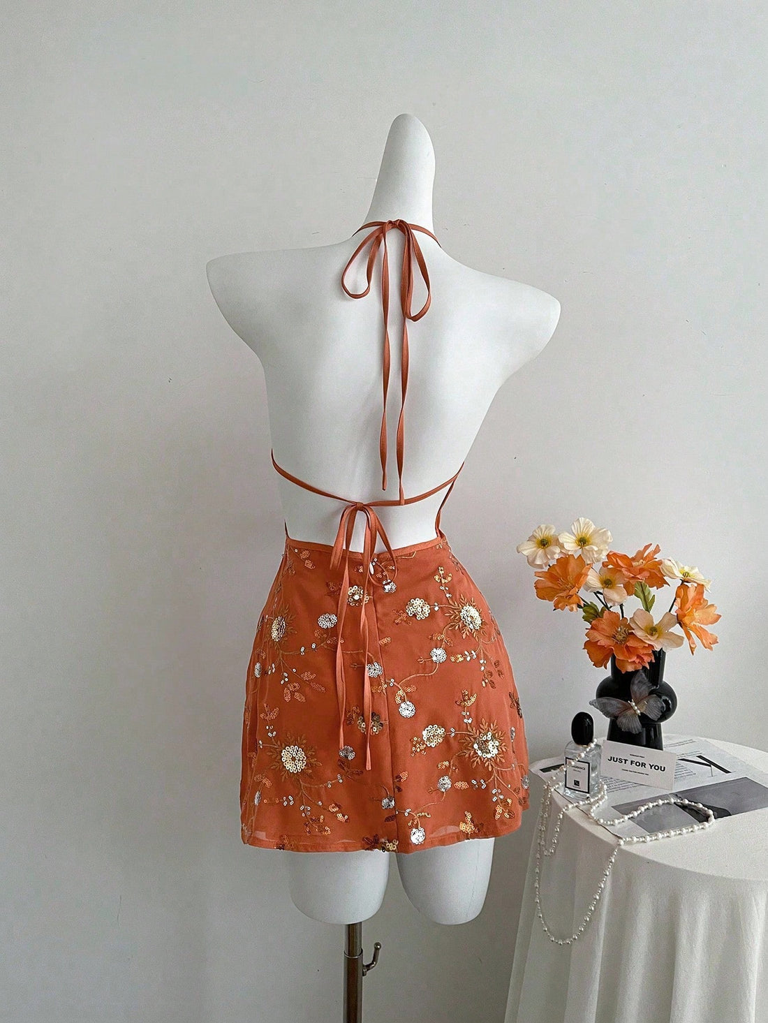 Turn heads this summer with our Women's Beaded Halter Mini Dress, designed for effortless beach vacation vibes. Its sparkling beadwork adds a touch of fun and glamour, while the halter neckline keeps you cool and stylish under the sun. Lightweight and flirty, this mini dress is your go-to for seaside strolls or sunset parties. Embrace the playful spirit of summer in a dress that’s as lively as your adventures!