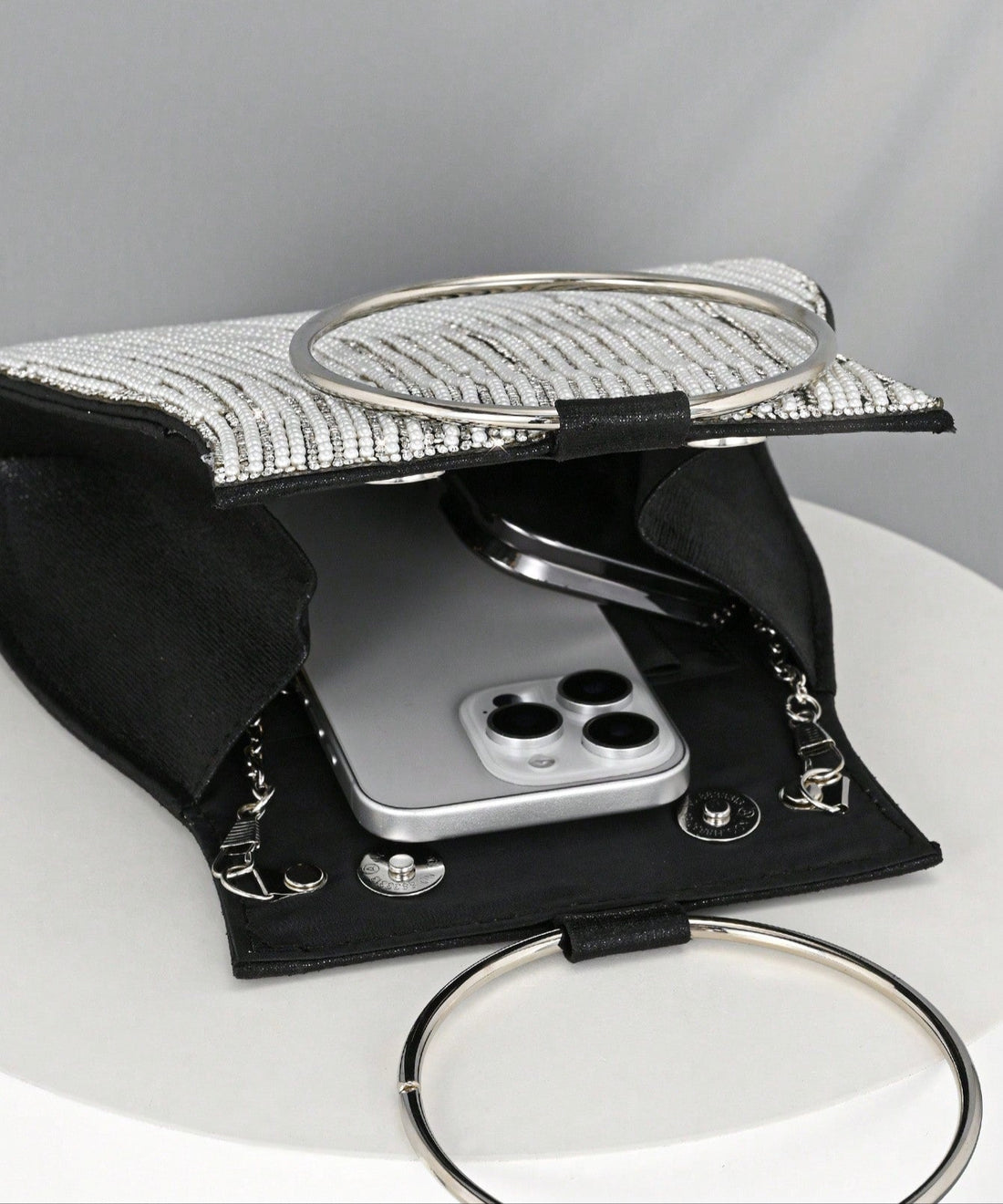 Add a touch of sparkle to your special night with this Irregular Clutch Handbag. Adorned with luxe faux pearls and shimmering rhinestones, it’s the perfect playful companion to weddings and formal events. Its unique shape stands out while comfortably holding your essentials, making you the star wherever you go. Shine bright and dance the night away with this dazzling evening bag!