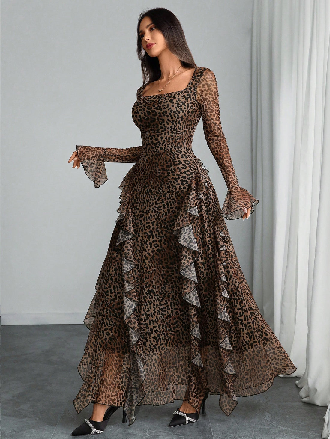 Embrace your inner fashion icon with this stunning Y2K-inspired leopard print dress that blends retro vibes with contemporary edge. Featuring an abstract animal print in rich, moody tones, the long sleeves and flattering pleated silhouette create a look that's both sophisticated and undeniably cool. Perfect for turning heads at any occasion, this dress celebrates modern femininity with a nostalgic twist. Slip it on and let your style do the talking.