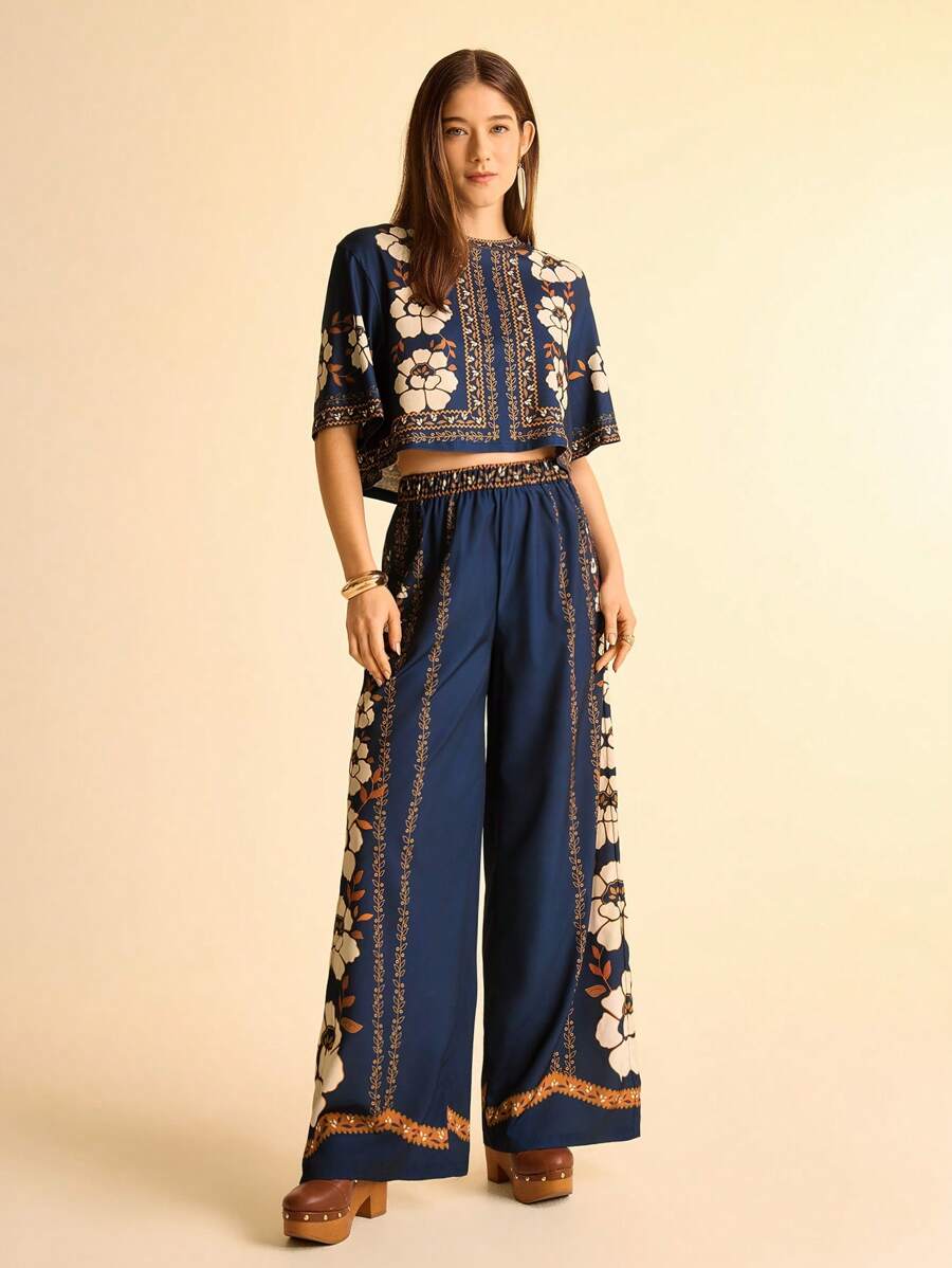 Front view of navy floral crop top and wide-leg pants set showing visible print, color, and silhouette