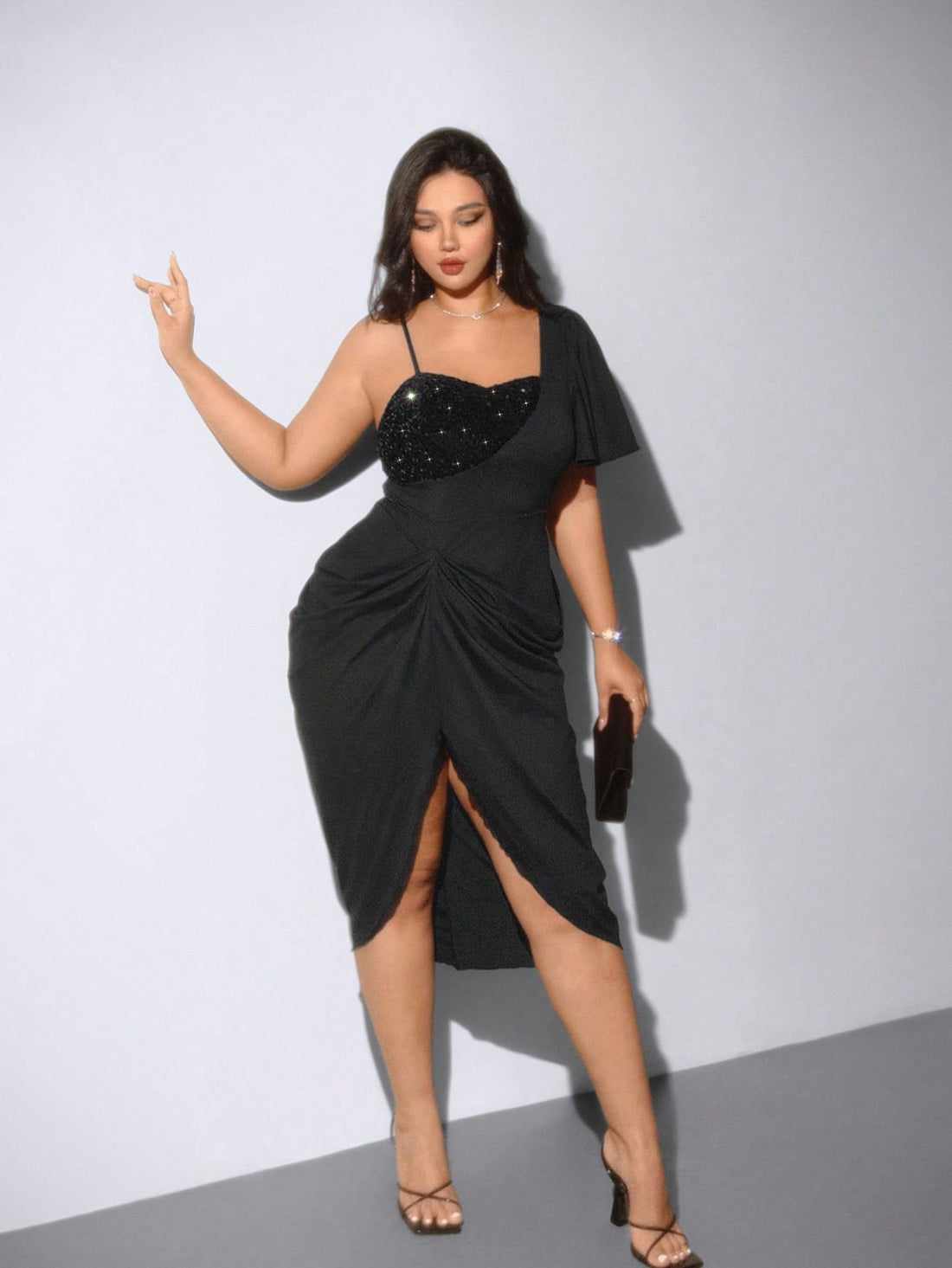 Step out in style with this Elegant Plus Size Asymmetric Collar Dress, designed to flatter your curves while adding a touch of sparkle. The unique asymmetric collar and shimmering rhinestone details create a playful yet sophisticated look perfect for any occasion. Comfortable and chic, this dress lets you shine with confidence wherever you go.