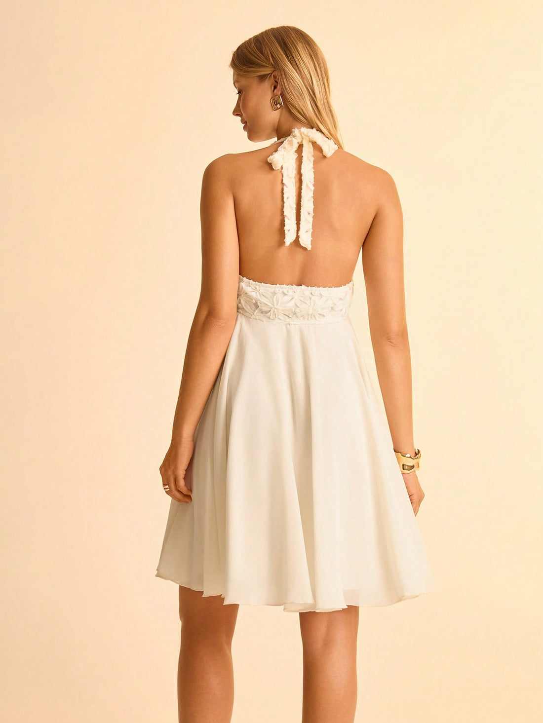 Step into summer with this Chic Beige Floral 3D Chiffon Dress, designed to turn heads with its playful asymmetrical hem and delicate halter tie. Lightweight and breezy, it’s perfect for warm vacation days, offering comfort and style that floats with your every move. The subtle 3D floral details add a touch of whimsy, making this dress a radiant choice for sunny adventures.