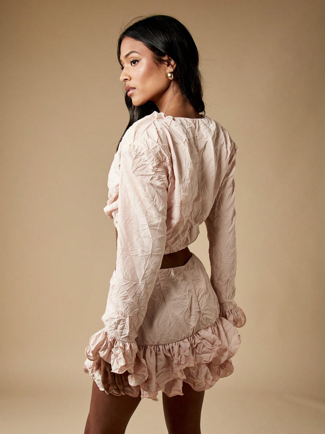 Turn heads this season with our ruffled crinkle texture two-piece set—the ultimate festival and night-out combo. The cropped top features playful ruffled details that catch the light, while the matching mini skirt brings that flirty, carefree vibe you're craving. The textured crinkle fabric adds dimension and movement with every step, making you feel as fabulous as you look. Perfect for summer adventures, music festivals, or dancing into the night. Mix, match, or wear together for endless styling possibilit