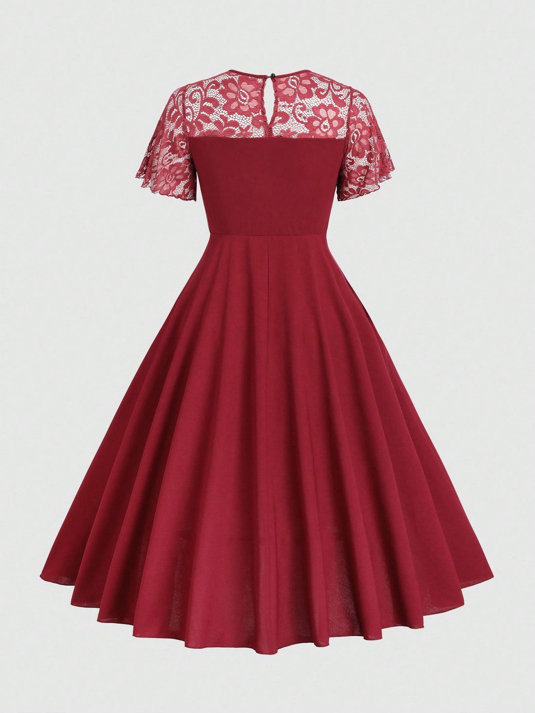 Step out in style with this Elegant Plus-Size Lace Patchwork Flared Dress. Featuring delicate lace patchwork, short sleeves, and a flattering round neck, it combines comfort with a flirty flair. The flared silhouette adds a playful bounce to your look, perfect for any occasion where you want to feel confident and charming.