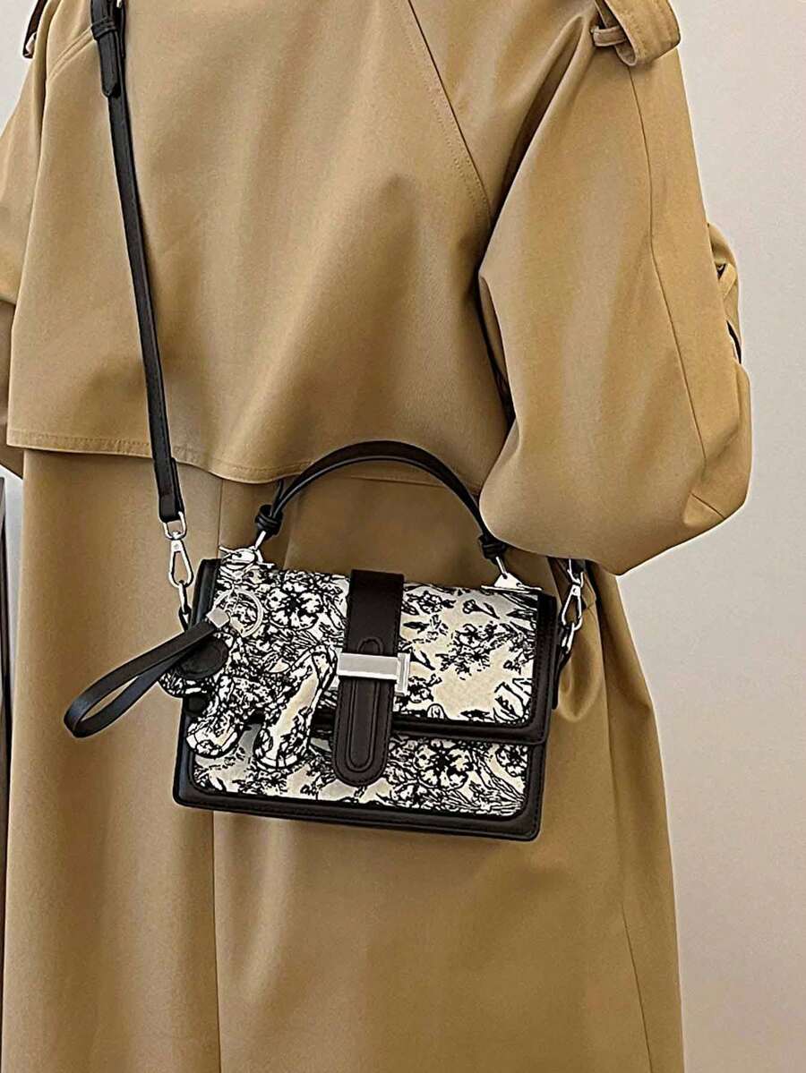 Black and white floral structured handbag with top handle