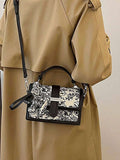 Pink floral printed handbag with flap front