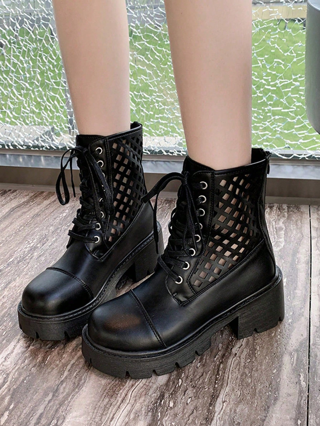 Step out in style with these chic black hollow lace-up boots, designed to add a playful edge to your daily commute. The chunky heel offers both comfort and confidence, while the hollow details keep your look fresh and breathable. Perfect for turning heads on the go without sacrificing practicality.