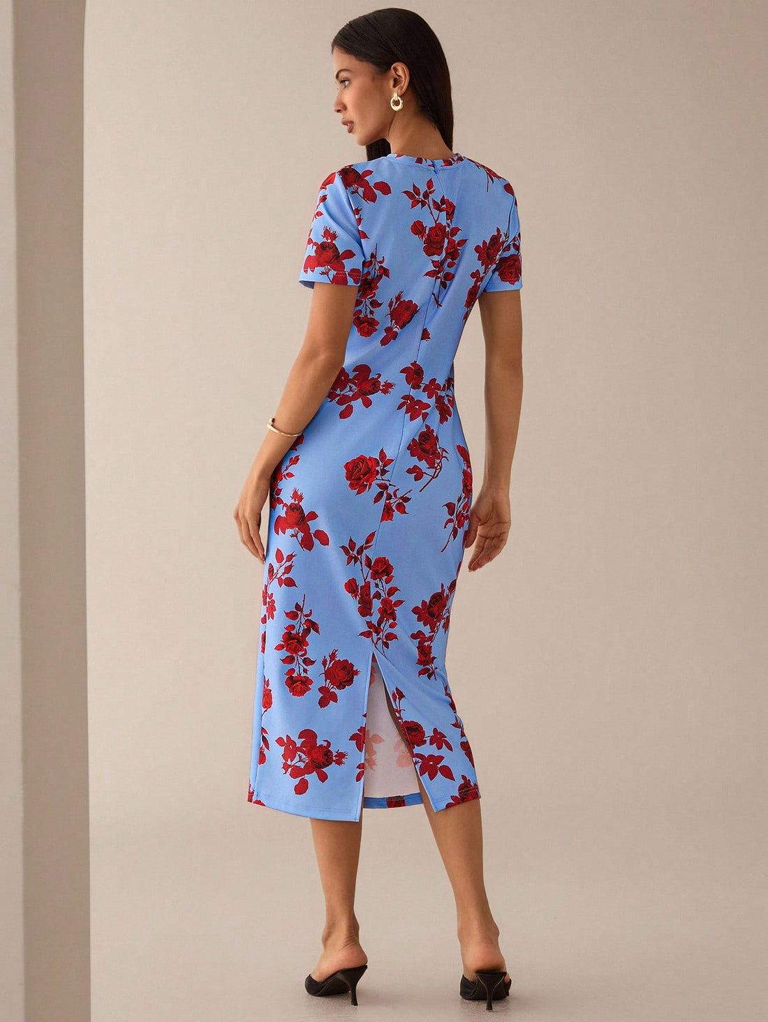 Step out in style with this playful blue floral printed mid-length dress, perfect for romantic dates or casual outings. Its charming print and flattering cut bring a fresh, fun vibe to your wardrobe, making every moment feel special and effortlessly chic.