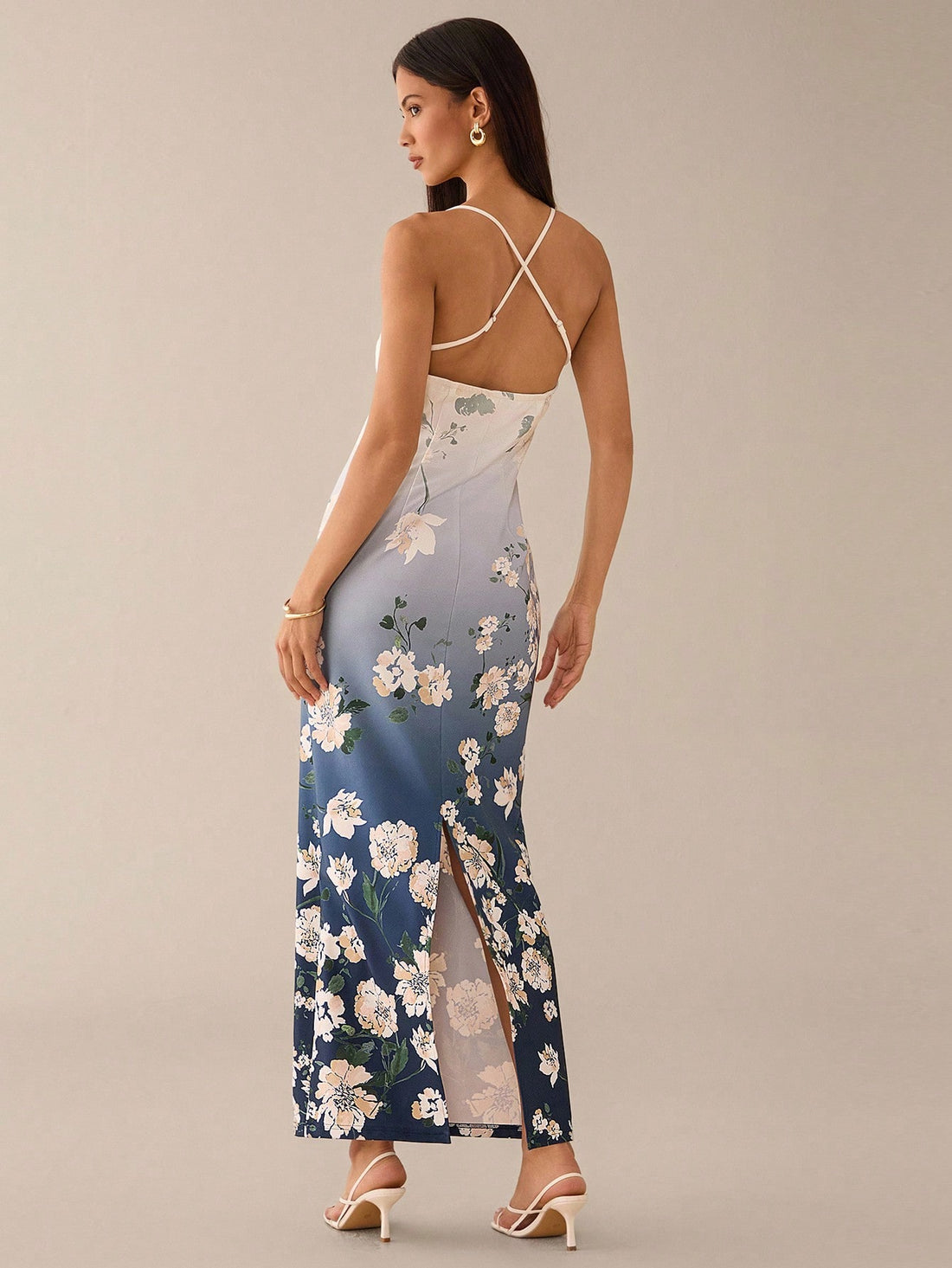 Step out in style with this playful blue and white floral gradient halter dress. Perfect for romantic dates or lively city adventures, its flattering silhouette and breezy design keep you comfortable and chic all day long. Embrace the charm of delicate florals blended with a fresh gradient for a look that’s effortlessly captivating.