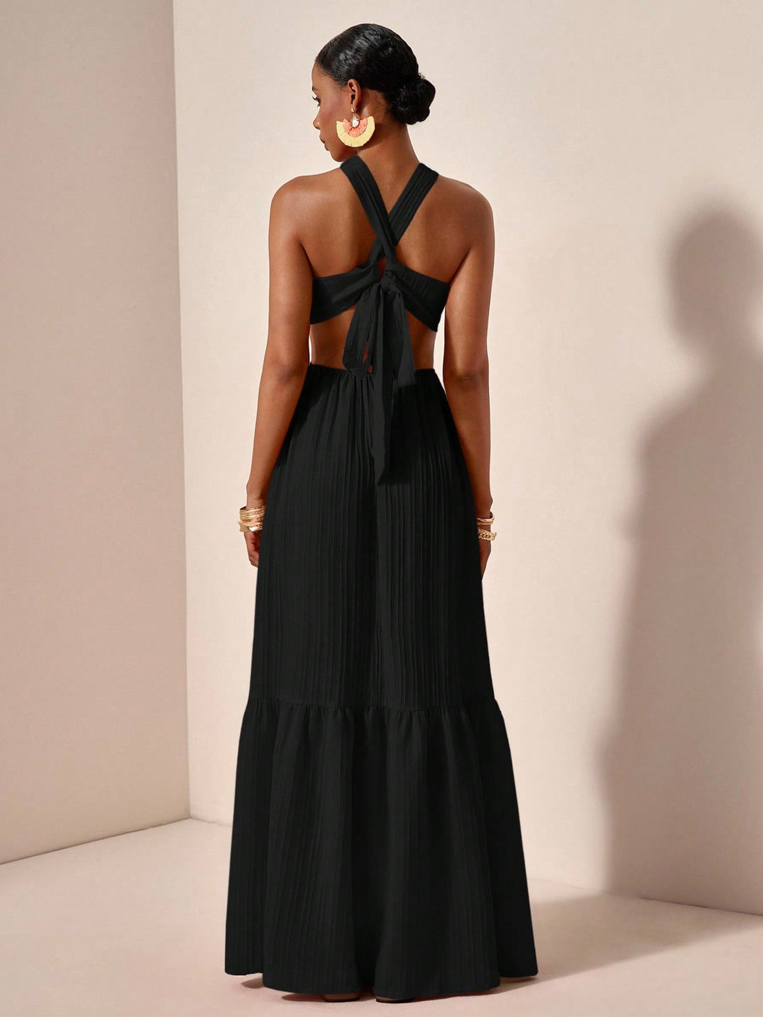 Turn heads in the Orange Wave Maxi Dress, where elegance meets edge. Featuring a playful cross halter neck and daring backless design, this dress flows beautifully with a gathered hem that adds movement and charm. Perfect for making a bold statement at any summer soirée or beachside escape. Embrace vibrant style with a twist of fun!