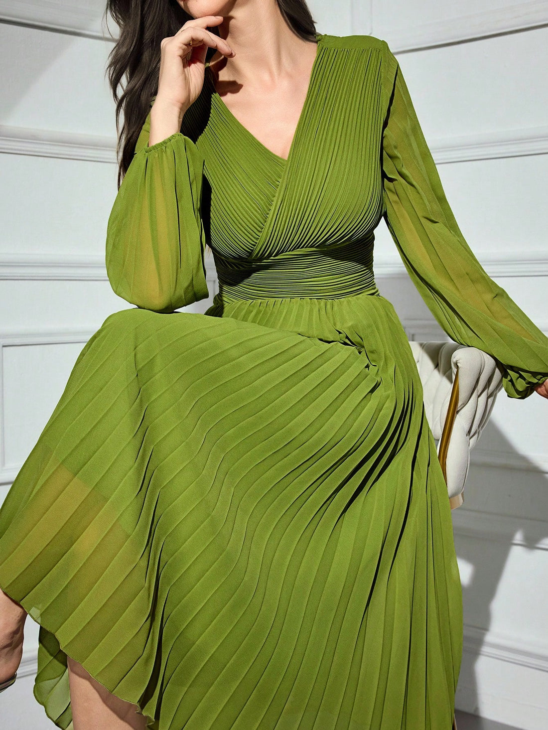 Wrap yourself in effortless elegance with this stunning midi dress that's equal parts sophisticated and fun. The flattering cross-wrap V-neck and pleated details create beautiful movement and dimension, while long sleeves keep things polished and timeless. Available in a classic solid color, this versatile piece transitions seamlessly from office to evening—just add your favorite accessories and you're ready to turn heads. Perfect for anyone who believes style should feel as good as it looks.