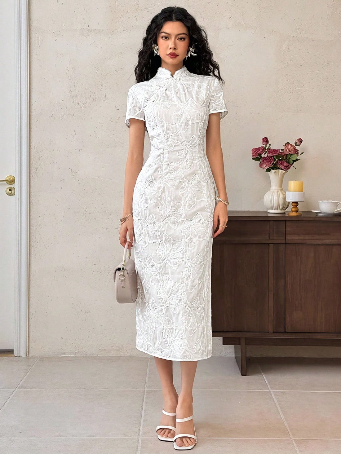 Step into summer with this playful twist on tradition. Our Elegant Summer Embroidered Midi Dress dazzles with vibrant floral embroidery inspired by classic Chinese Cheongsam Qipao designs. The flattering midi length and lightweight fabric keep you cool while turning heads at every garden party or brunch. Embrace elegance with a hint of whimsy in this unique dress that celebrates style and comfort in every stitch.